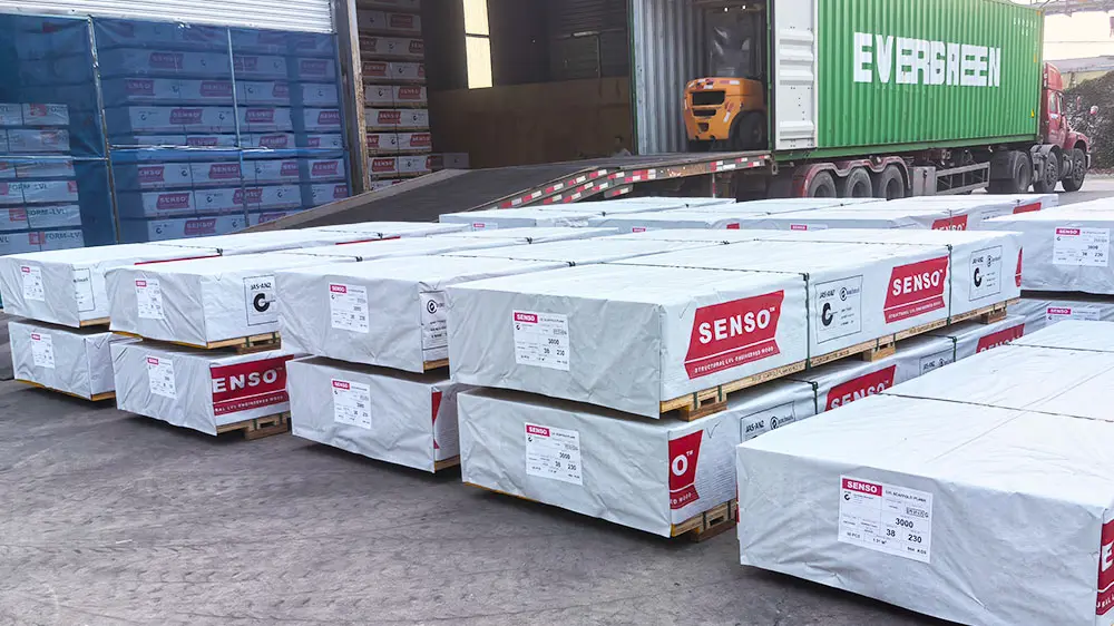 SENSO OSHA boards packed in export bundles beside container loading area for scaffold plank wholesale supply