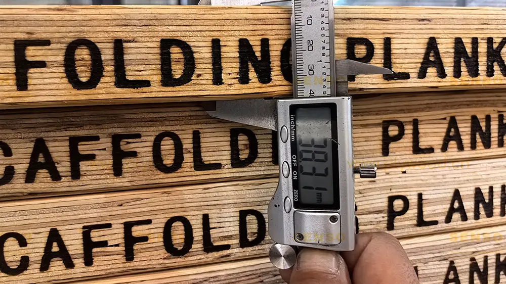 Digital caliper inspection of SENSO OSHA board thickness for scaffold plank quality control and order approval